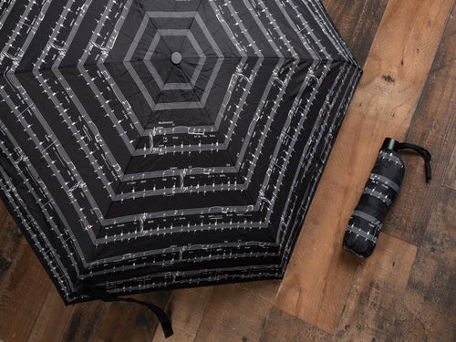 A walk in a rain becomes delightful with the black and white 9 inch mini automatic open and shut push button 32 inch umbrella with open width. Velcro closing cover included.