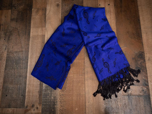 Classy all year ‘round with our elegant music themed pashminas. 70% pashmina fibers and 30% silk. 72 inches by 27 inches. Weight 0.50 lb. Color: Royal Blue