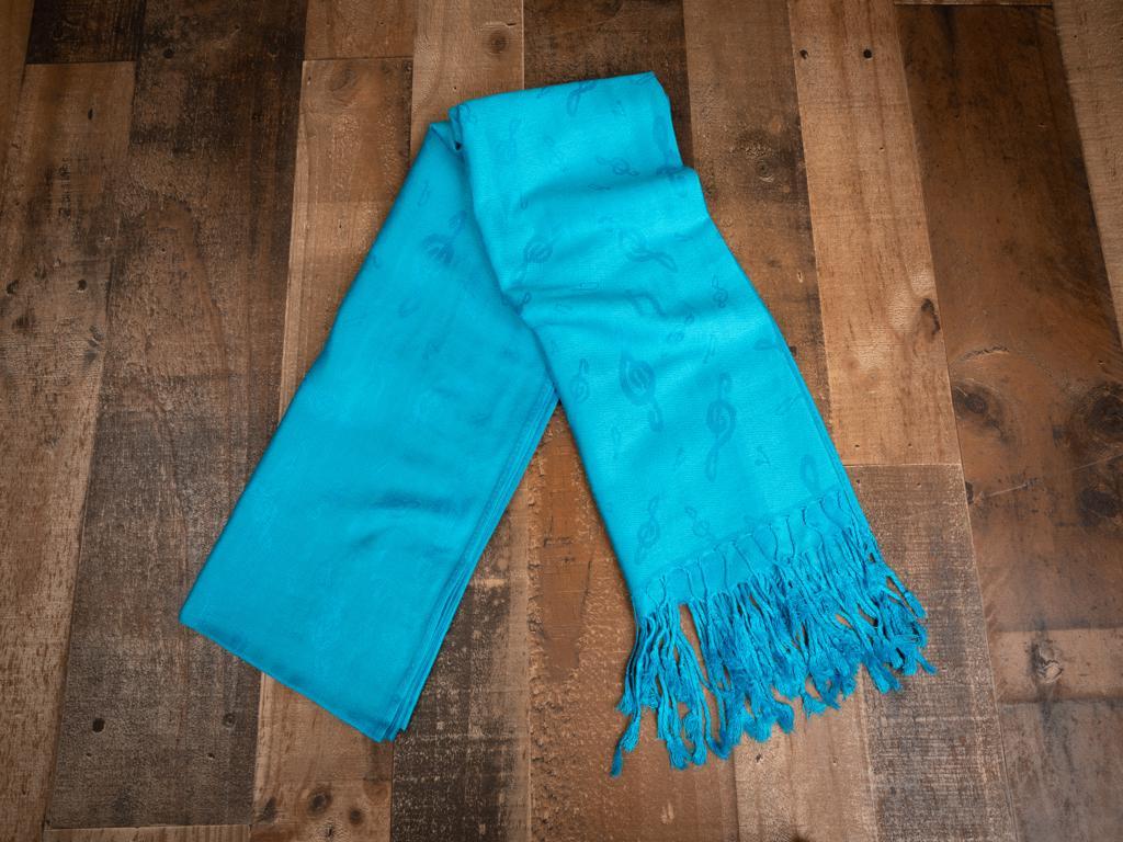 Classy all year ‘round with our elegant music themed pashminas. 70% pashmina fibers and 30% silk. 72 inches by 27 inches. Weight 0.50 lb Color: Turquoise 